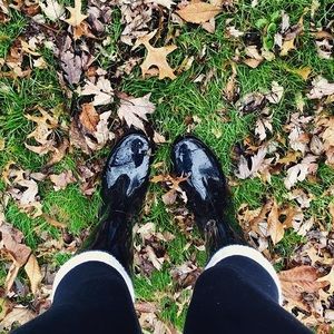 Black glossy tall rain boots